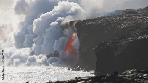Molten lava flowing into the Pacific Ocean on Big Island of Hawaii photo