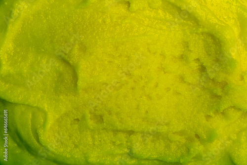 Baby food, vegetable puree close-up. Green mashed broccoli, spinach and apple chopped in a blender. Background texture of food for newborn children.