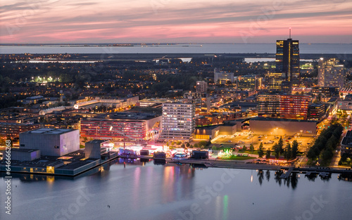 Almere city center illuminated at dusk. Aerial view.