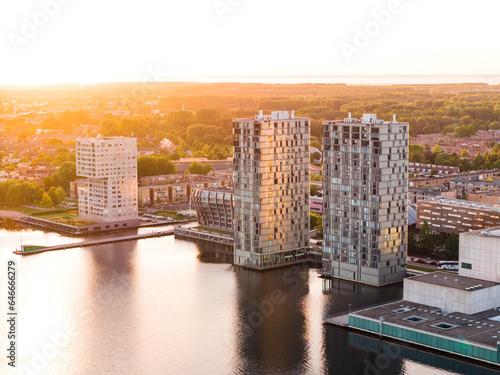 Modern architecture of Almere city, Flevoland, The Netherlands. Aerial shot at sunset.
