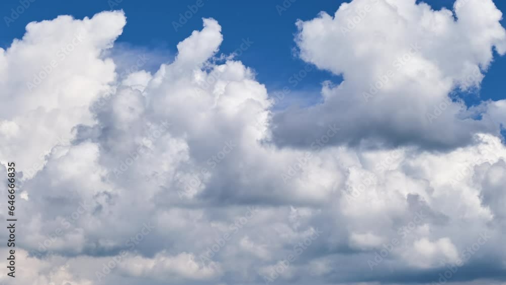 Timelapse of white puffy cumulus clouds forming on summer blue sky. Moving and changing cloudscape weather Timelapse of white puffy cumulus clouds forming on summer blue sky. Moving and changing cloudscape weather