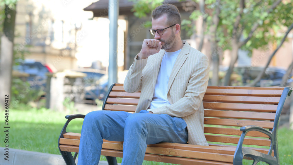 Coughing Middle Aged Man Sitting Outdoor Coughing Middle Aged Man Sitting Outdoor
