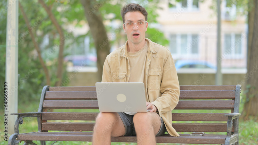 Fototapeta premium Rejecting Modern Young Man in Denail while Sitting Outdoor