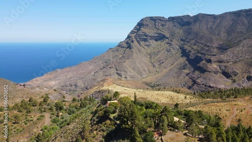 Tamadaba Natural Park, Tirma: aerial view in orbit in a fantastic landscape with high mountains like Roque Faneque. On a sunny day on the island of Gran Canaria. photo