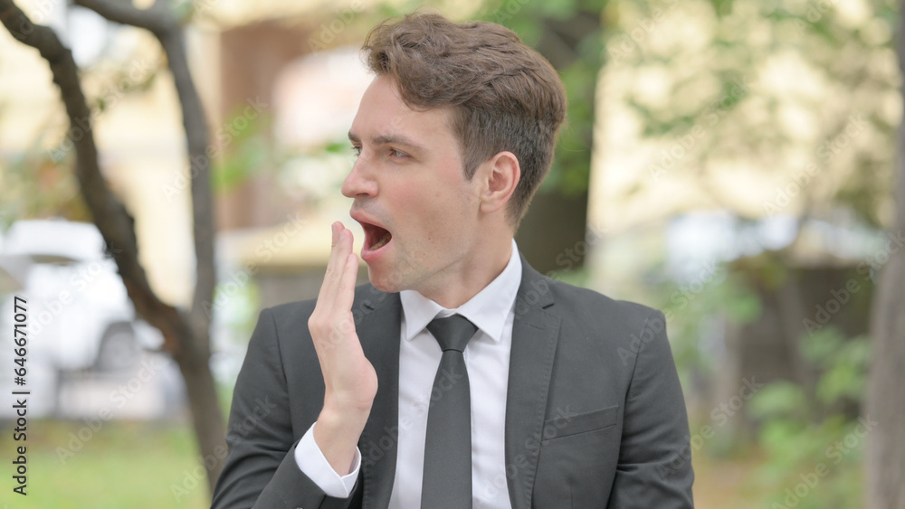 Outdoor Portrait of Yawning Tired Businessman Outdoor Portrait of Yawning Tired Businessman