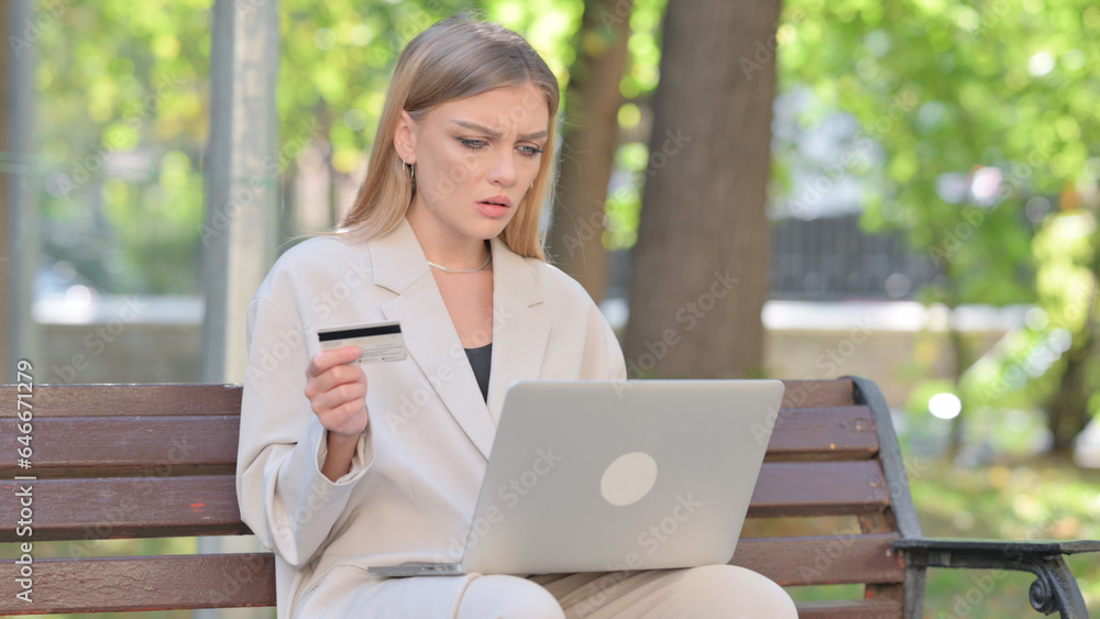 Young Businesswoman Upset by Online Payment Failure on Laptop Outdoor Young Businesswoman Upset by Online Payment Failure on Laptop Outdoor