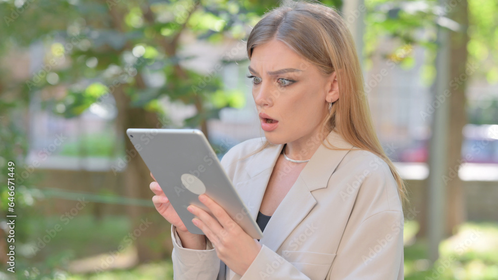 Businesswoman Upset by Loss on Tablet Outdoor Businesswoman Upset by Loss on Tablet Outdoor
