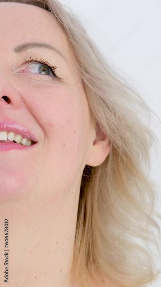 vertical video. sincere Blissful smile pleasure woman face on white background dancing to music closing eyes shaking head blonde high smiling tenderness beauty middle age cheerful vertical video. sincere Blissful smile pleasure woman face on white background dancing to music closing eyes shaking head blonde high smiling tenderness beauty middle age cheerful