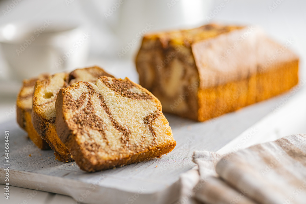 Marble sponge cake. Cake with cocoa and vanilla taste on cutting board.