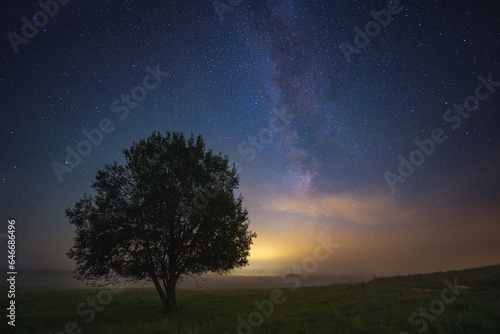 Night landscape with colorful Milky Way, spring sky