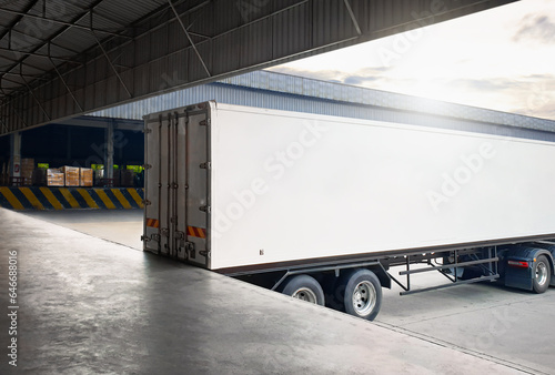 Container Trailer Trucks Loading at Dock Warehouse. Distribution Warehouse Shipping. Supply Chain, Merchandise, Supplies Shipment. Freight Truck Logistic, Cargo Transport. © Siwakorn1933