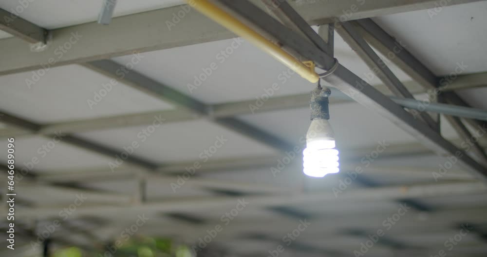 Abstract White Light Bulb On and off in rhythm close up.Light bulbs under the house. Abstract White Light Bulb On and off in rhythm close up.Light bulbs under the house.