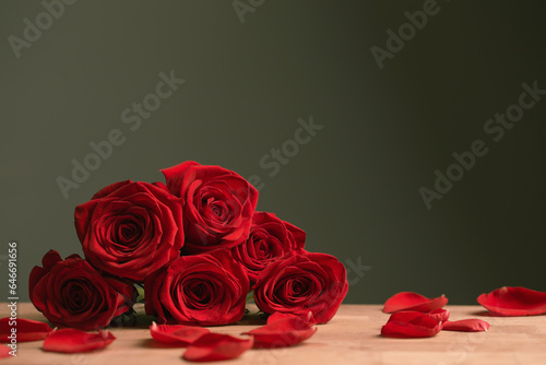 bouquet of red roses on green background