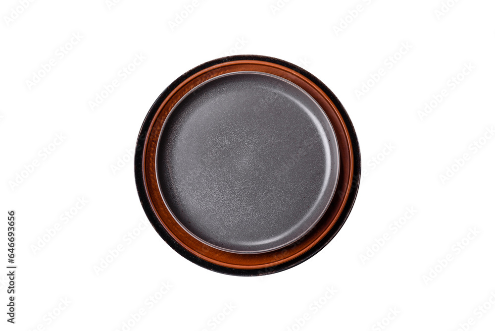 Empty black plate over dark stone background with free space. Top view Empty black plate over dark stone background with free space. Top view