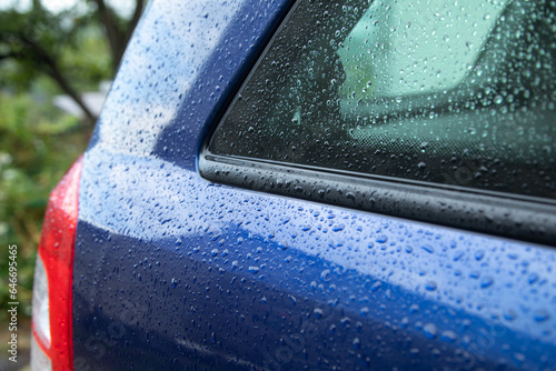 Car part after rain. Water drops