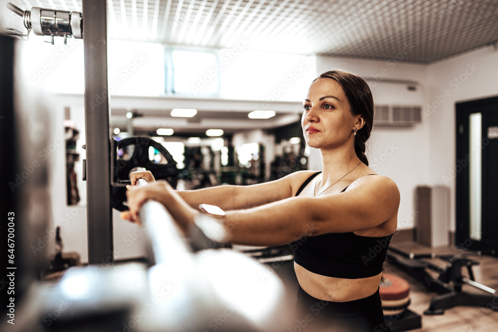 Portrait of a female personal trainer in a gym Portrait of a female personal trainer in a gym