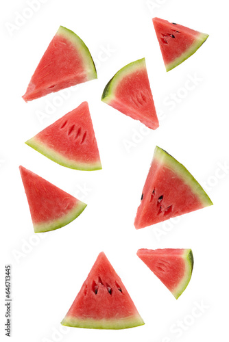 Triangular slices of ripe watermelon floating on a white background.