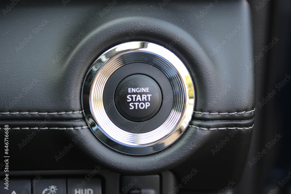 Close up of an engine start stop button - obrazy, fototapety, plakaty 
