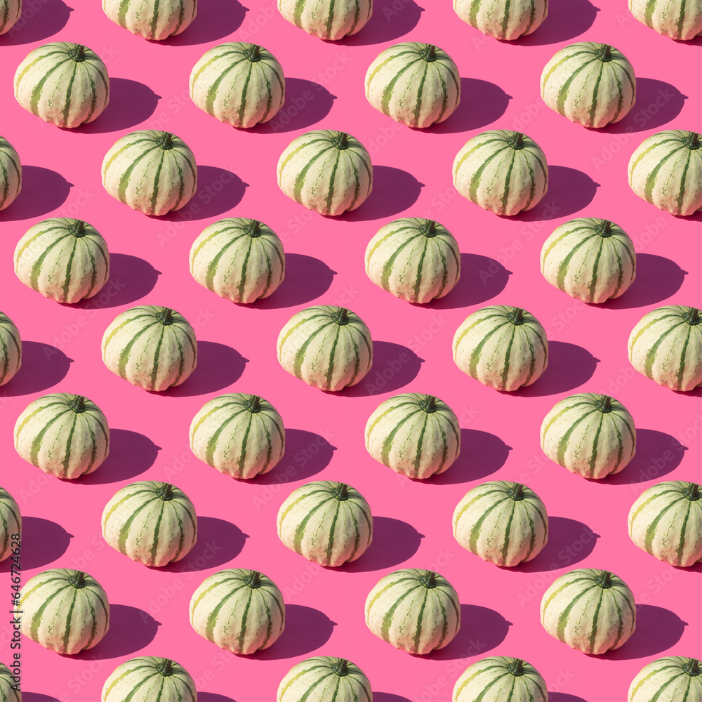 Repeating pattern of green striped pumpkin on a pink background Repeating pattern of green striped pumpkin on a pink background