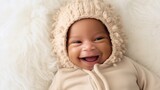 A happy newborn in neutral clothing, posing on a light beige studio background with a joyful smile. Generative AI