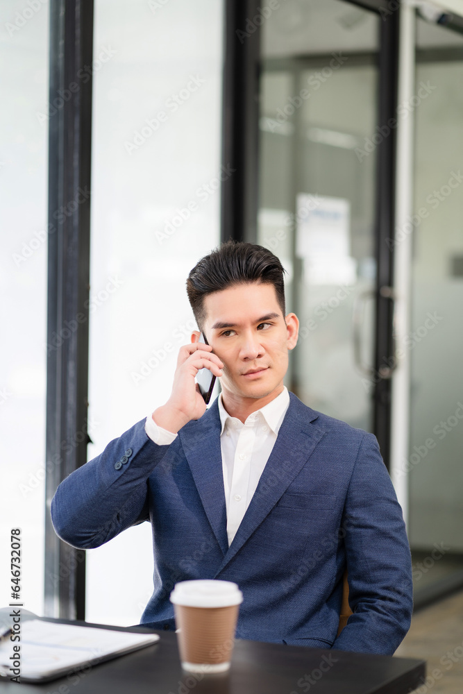 Male businessman talk mobile phones and working on laptop computers, online business, work from home, teleworking concept. Male businessman talk mobile phones and working on laptop computers, online business, work from home, teleworking concept.
