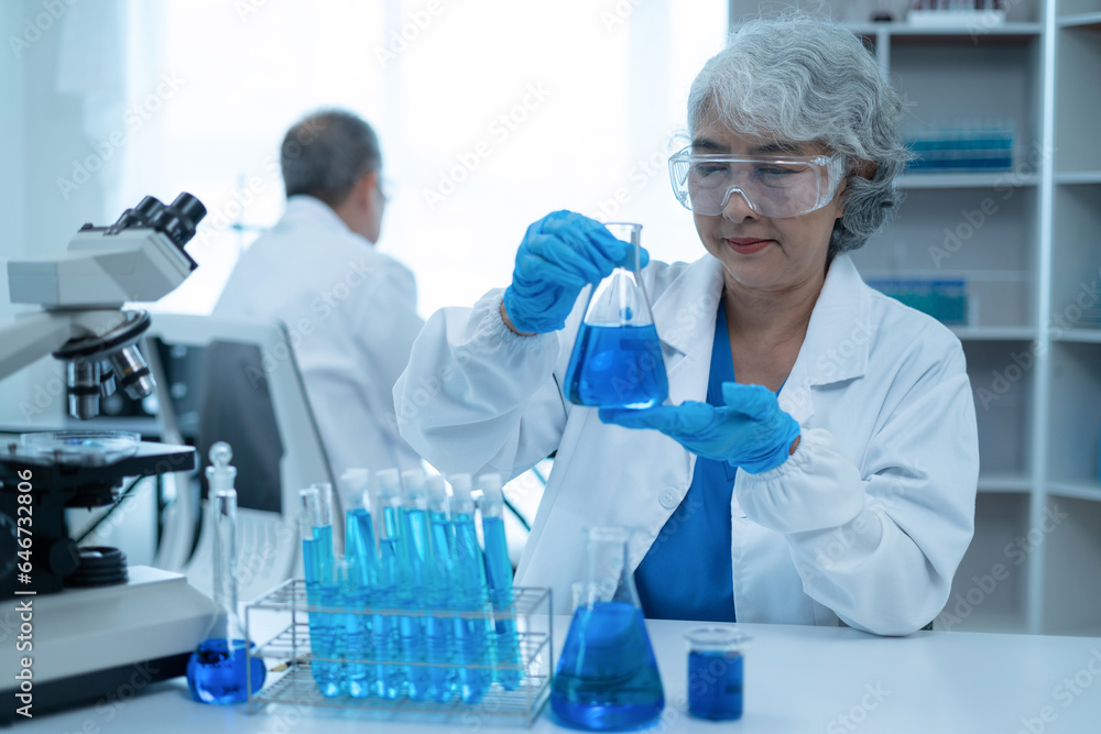Scientist works with a pipette and a test tube. Scientific laboratory of biotechnology, development of medicine and research in chemistry, biochemistry and experiments. Scientist works with a pipette and a test tube. Scientific laboratory of biotechnology, development of medicine and research in chemistry, biochemistry and experiments.
