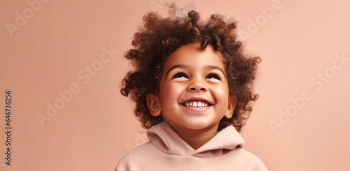 Happy kid in muted outfit, posing on a beige studio background. Generative AI