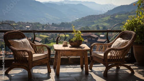 chairs and table near the window and see the mountain view in the rural villa in the morning sunrise © MBRAMO