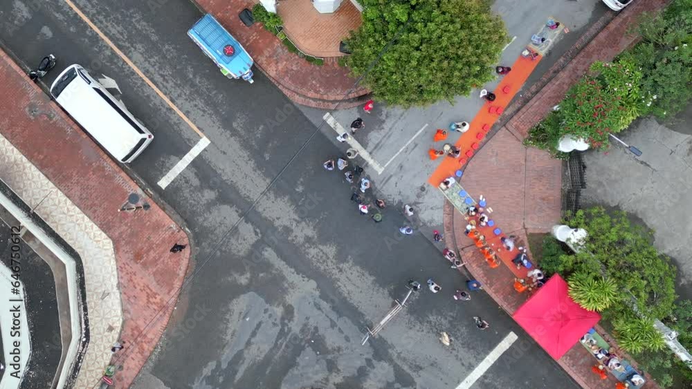 Aerial view of morning alms collection by Buddhist monks on the streets of Luang Prabang in Lao. Aerial view of morning alms collection by Buddhist monks on the streets of Luang Prabang in Lao.