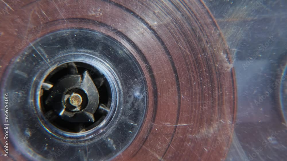 Old music audio player. Rotating tape on an old vintage cassette. Retro music concept. Old music audio player. Rotating tape on an old vintage cassette. Retro music concept.