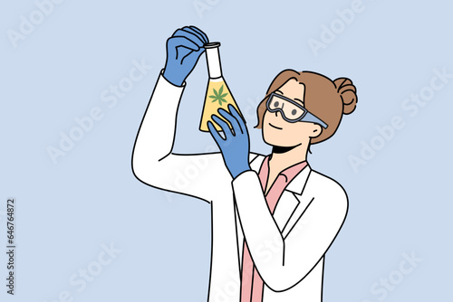 Woman laboratory assistant with cannabis oil in test tube explores healing properties marijuana. Girl scientist working on creation of medicines from cannabis, holding flask with green narcotic oil