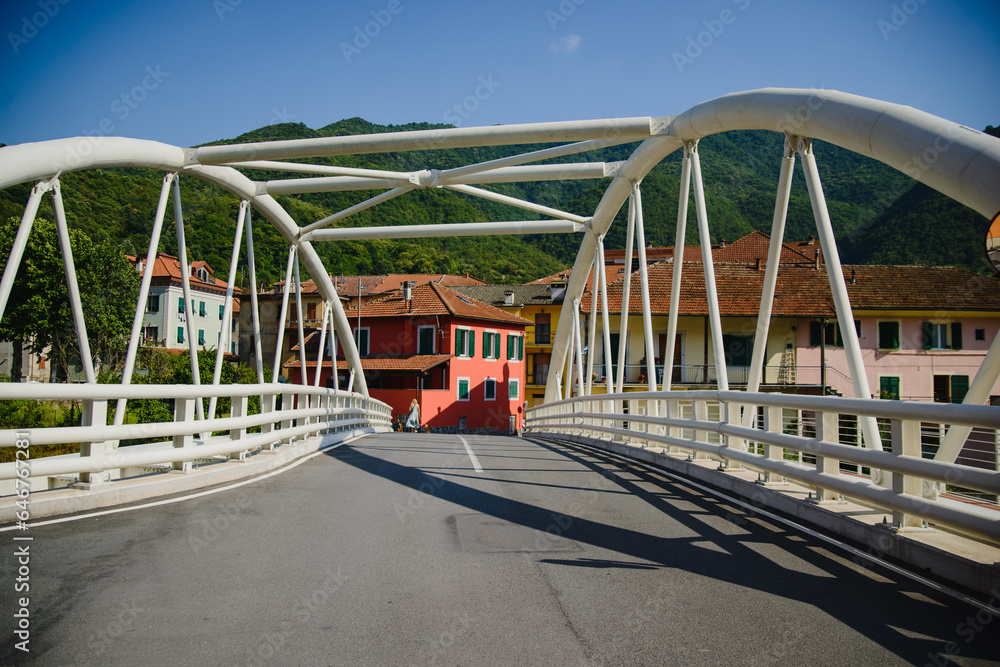 European landscape with river, bridge, mountains and colored houses on the background European landscape with river, bridge, mountains and colored houses on the background
