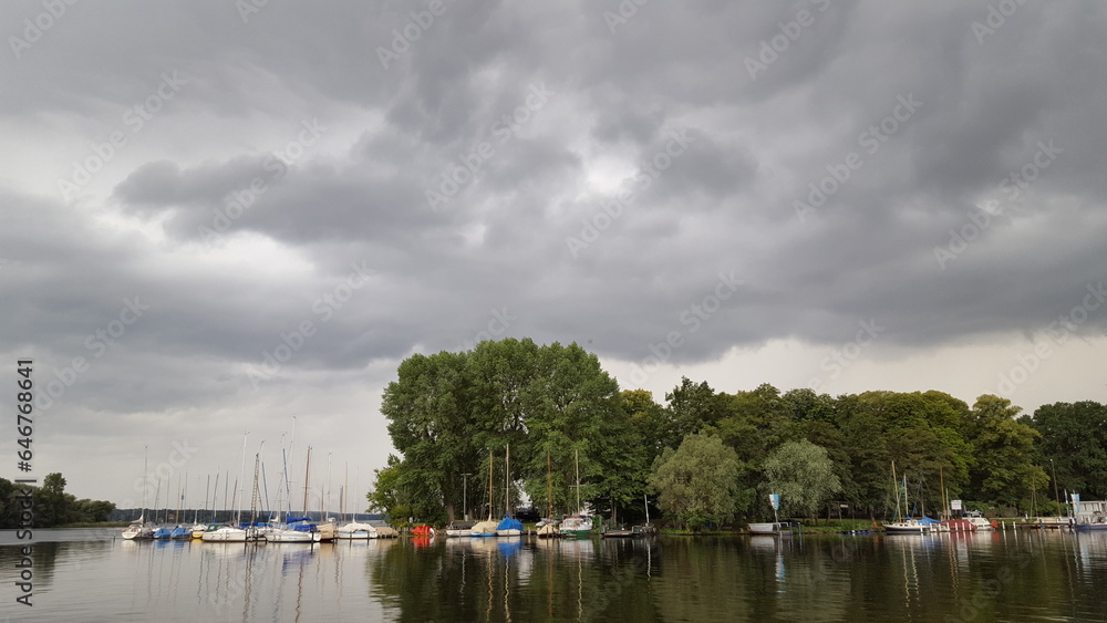 A diverse fleet of boats, ranging from sleek sailboats to sturdy fishing vessels, gracefully bob and float upon the water. A diverse fleet of boats, ranging from sleek sailboats to sturdy fishing vessels, gracefully bob and float upon the water.