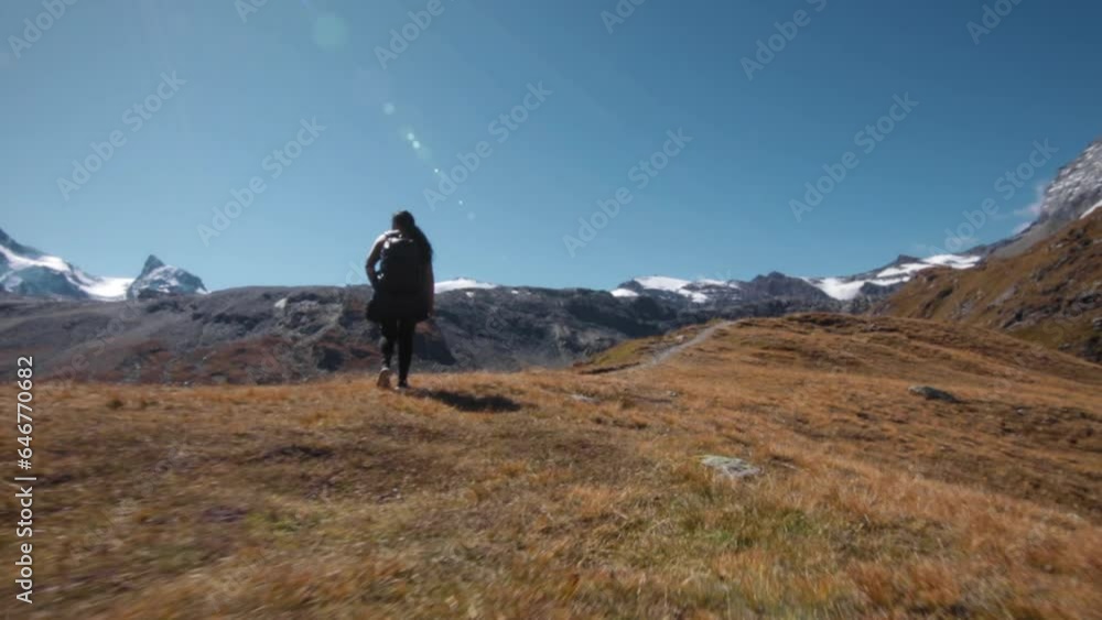 Dolly Shot of Hiker in Alps Mountains in Switzerland Dolly Shot of Hiker in Alps Mountains in Switzerland