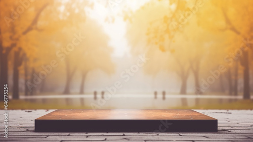 autumn podium table top against the background of a blurred autumn park in yellow tones and leaves.
