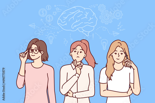 Team of business women is brainstorming while developing plan to promote own startup. Girls are engaged in teamwork and brainstorming to achieve goals and fulfill plans set by manager
