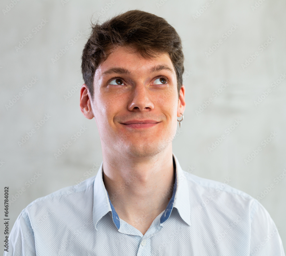 Obraz premium Emotions, people and positive concept man expresses different on gray background