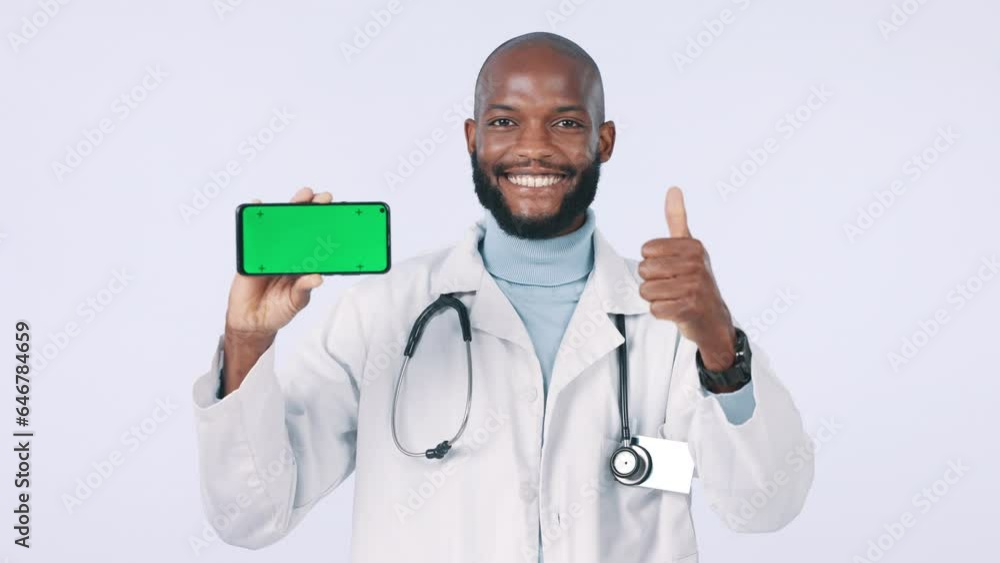 Green screen, phone and doctor with thumbs up in studio with mockup space for healthcare insurance app. Happy, tracking markers and face of black man medical worker with cellphone by white background Green screen, phone and doctor with thumbs up in studio with mockup space for healthcare insurance app. Happy, tracking markers and face of black man medical worker with cellphone by white background