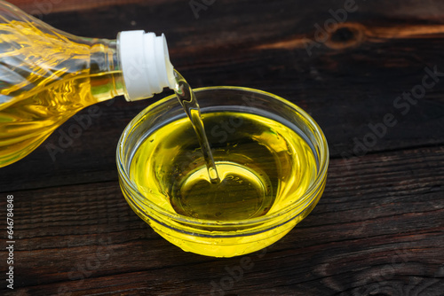 Sunflower cooking oil, on wooden table outdoors