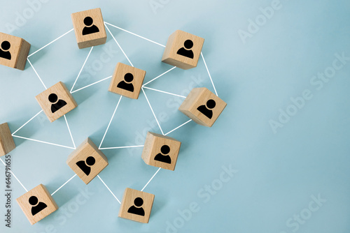 Connecting people, partnership, social media networks concept on blue background using wooden blocks. Digital communication, teamwork, network and community concept.