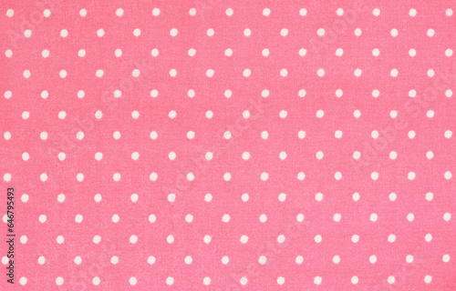 Texture of pink polka dot fabric