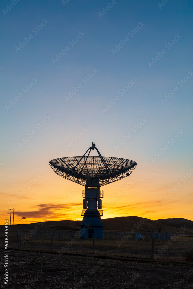 The observatory in the evening, the silhouette of the radio telescope The observatory in the evening, the silhouette of the radio telescope