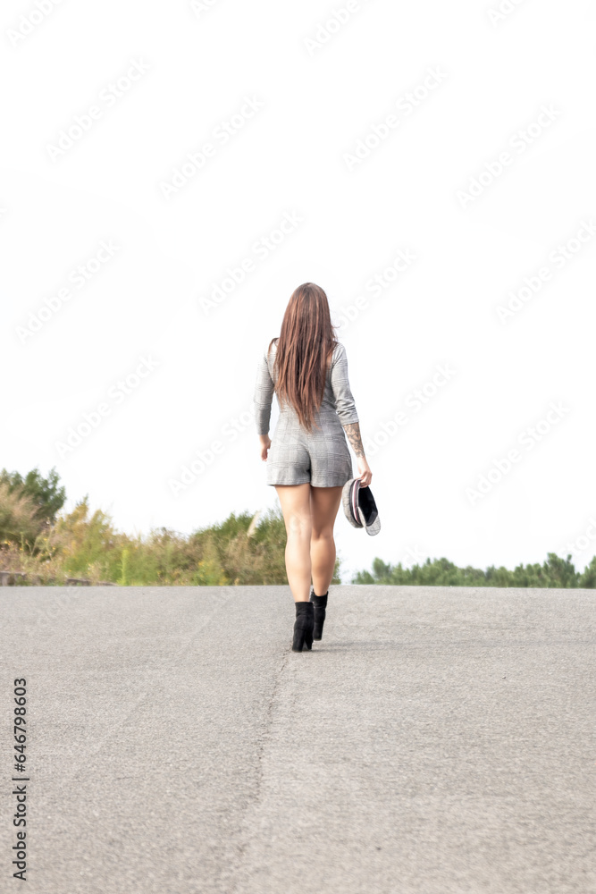 Fashionable Escape: A Stylish Brunette Beauty Embarks on a Journey Down the Open Road in Checkered Dress Fashionable Escape: A Stylish Brunette Beauty Embarks on a Journey Down the Open Road in Checkered Dress