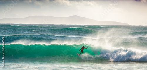 Tableau sur toile A man surfing on a wave at Crescent Head in NSW on a summer's day