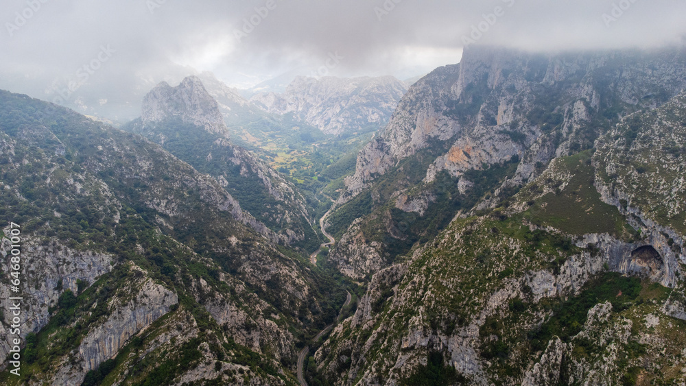 La Hermida gorge and the Picos de Europa with looming clouds. Cantabria, Spain.