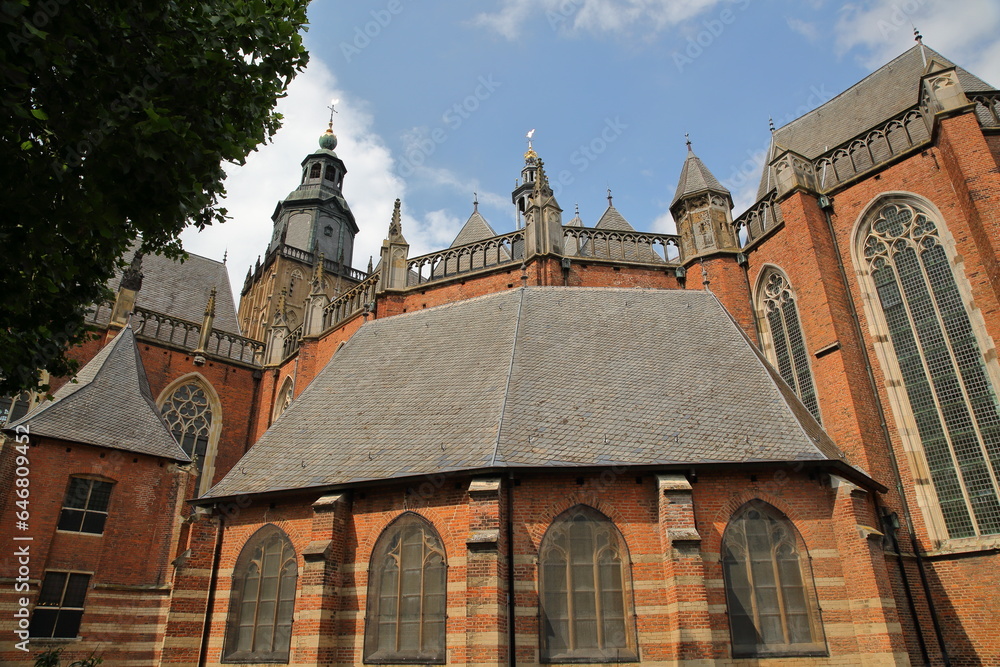 The impressive external facade of Saint Walburgiskerk church with turrets and the bell tower in Zutphen, Gelderland, Netherlands