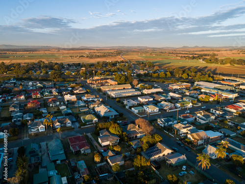 Morning sunlight at sunrise on building rooftops in small town