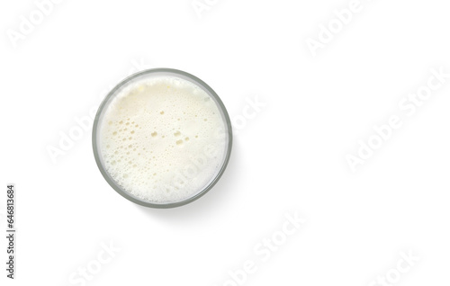 Milk foam in a glass. Top view isolated on white background.