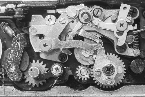 Close-up of the mechanics and gears of an old piece of equipment.Concept of industrial and mechanical systems