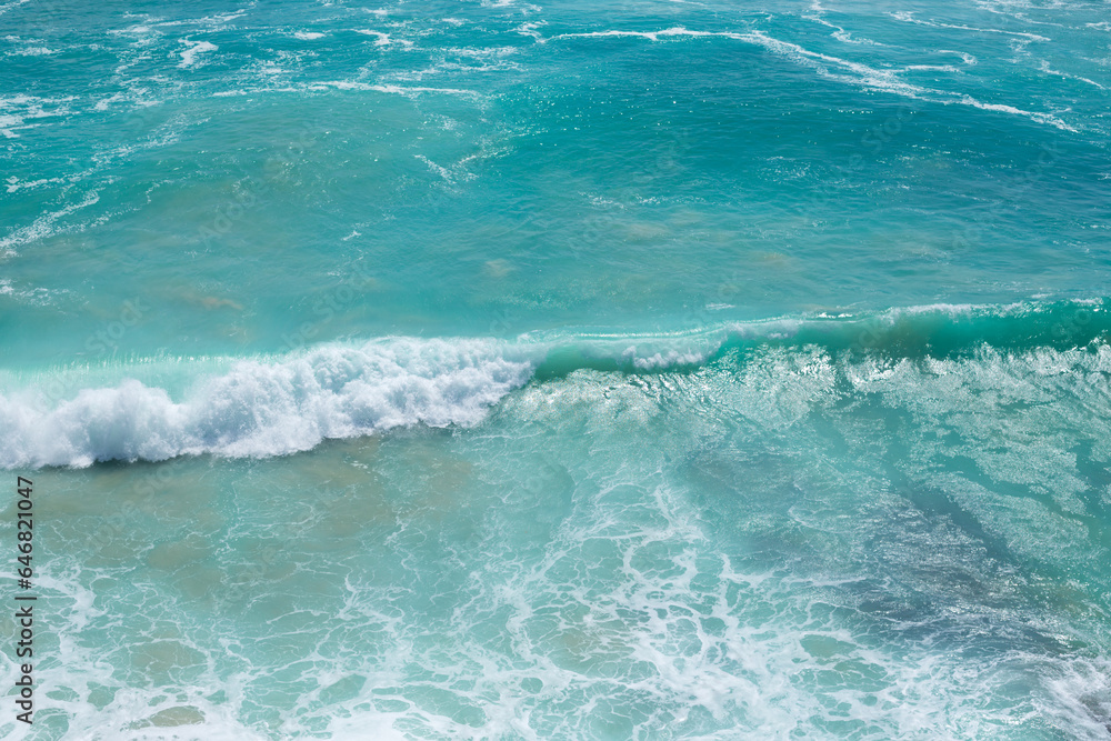 Beautiful view of the blue wave with white foam. Peak waves in the ocean